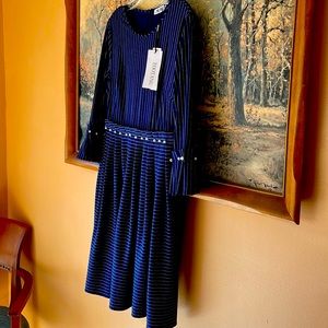 A dressy navy dress with faux pearl trim.  Never worn.